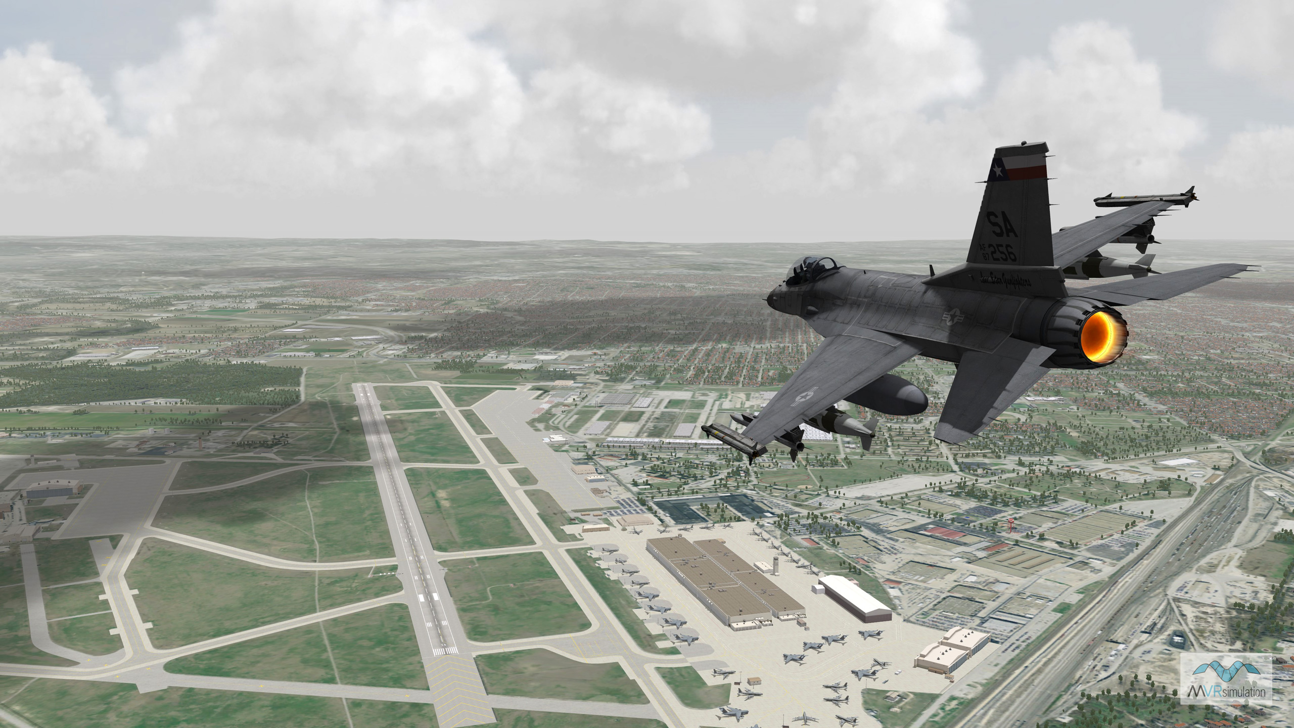 MVRsimulation VRSG real-time scene of an F-16 entity in flight over virtual Kelly Field at Lackland Air Force Base.