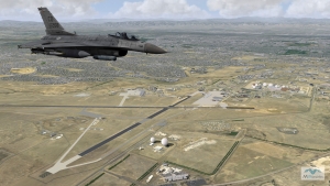 MVRsimulation VRSG real-time scene of an F-16 entity in flight over  geospecific 3D terrain of Buckley Air Force Base, and Aurora, and Greater Denver.
